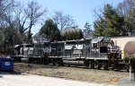 NS 5040 & 5808 are power for train E60 and are pushing a train into the yard